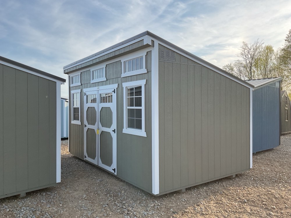 Single slope shed, 10 by 16, gray siding with white trim, windows, and double doors